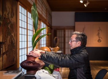 David Komeiji arranging ikebana for Hanakago Art in the Garden exhibition
