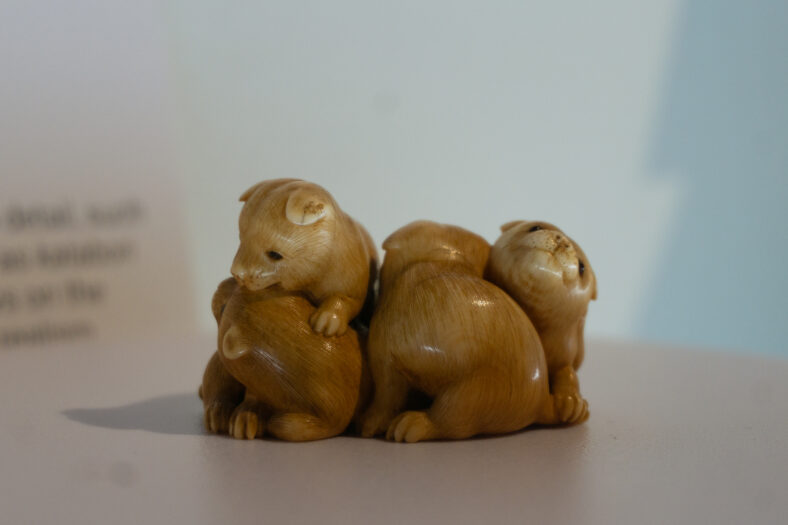 Japanese Netsuke miniature ivory sculpture depicting five puppies wrestling
