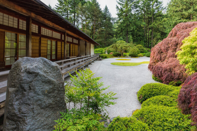 Portland Japanese Garden's flat garden with raked gravel and  a Pavilion next to it.